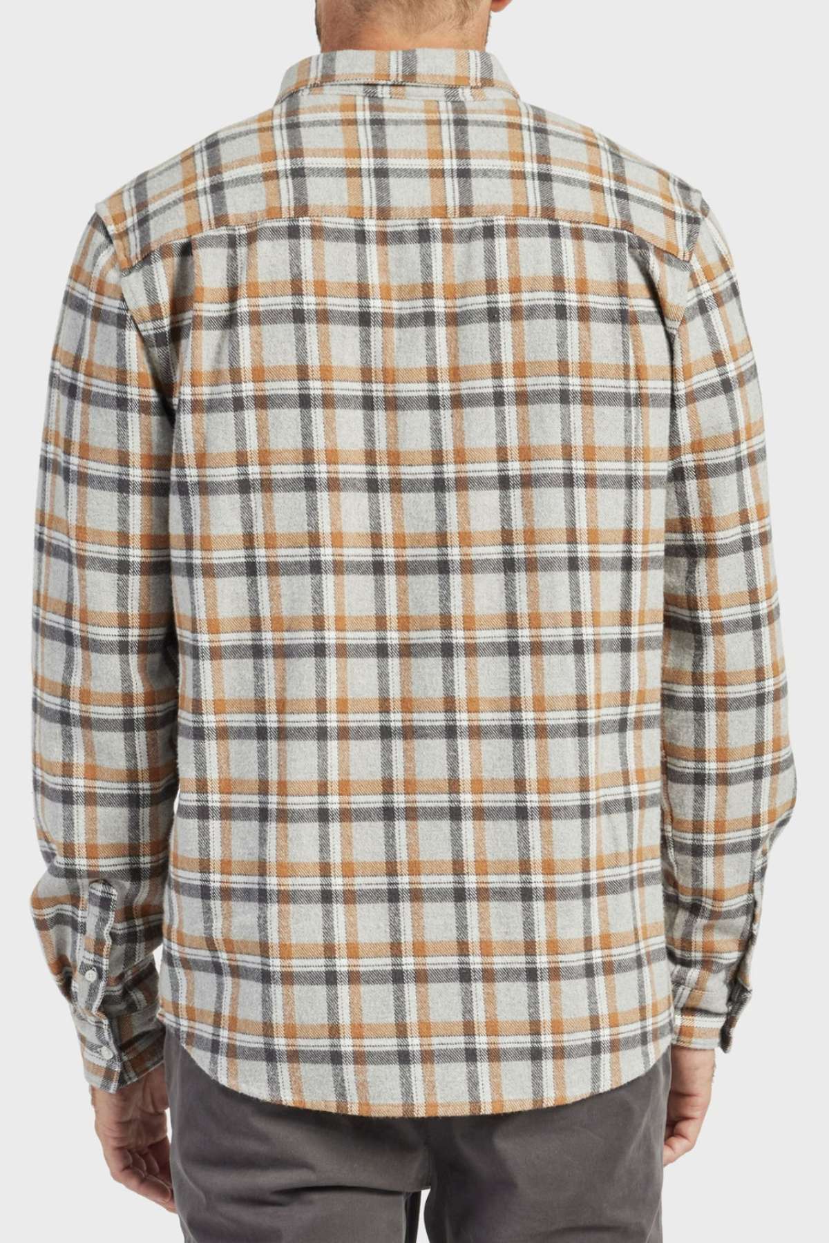 A person wearing the Academy Brand Boston Shirt, made from 100% cotton yarn-dye mid-weight beige, brown, and gray plaid fabric. Shown from the back with the shirt untucked and paired with dark pants.