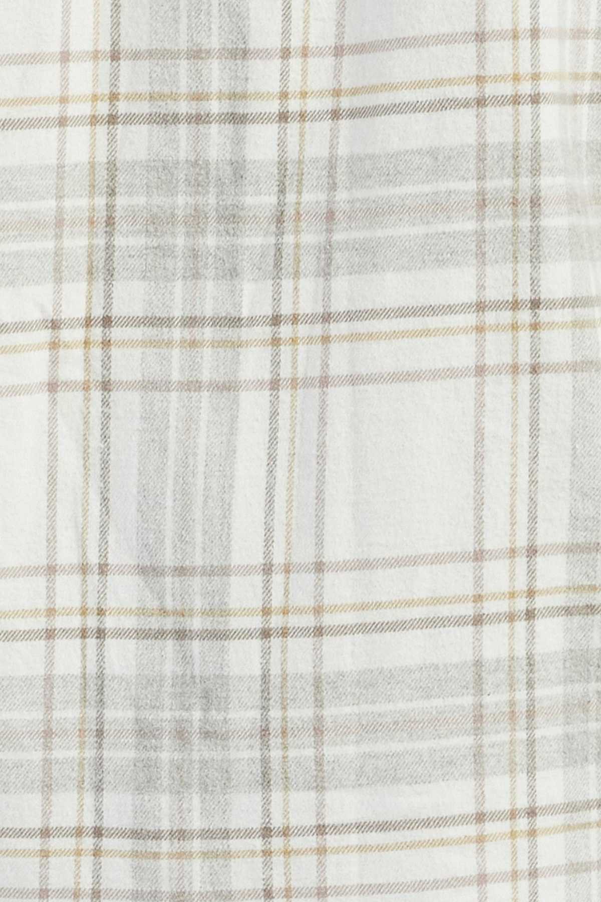 A close-up of the subtle plaid fabric pattern on the Academy Brand Edmond Check Shirt. The design consists of thin intersecting lines in shades of gray and beige on a soft off-white background, creating a light and neutral checkered appearance in mid-weight twill check.