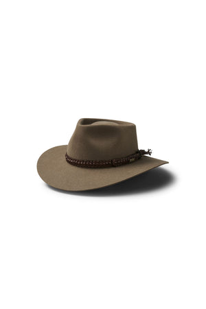 The Akubra The Brumby is a brown wide-brimmed hat featuring a creased crown and braided band, ideal for an Australian outback festival. Shown on a white background.