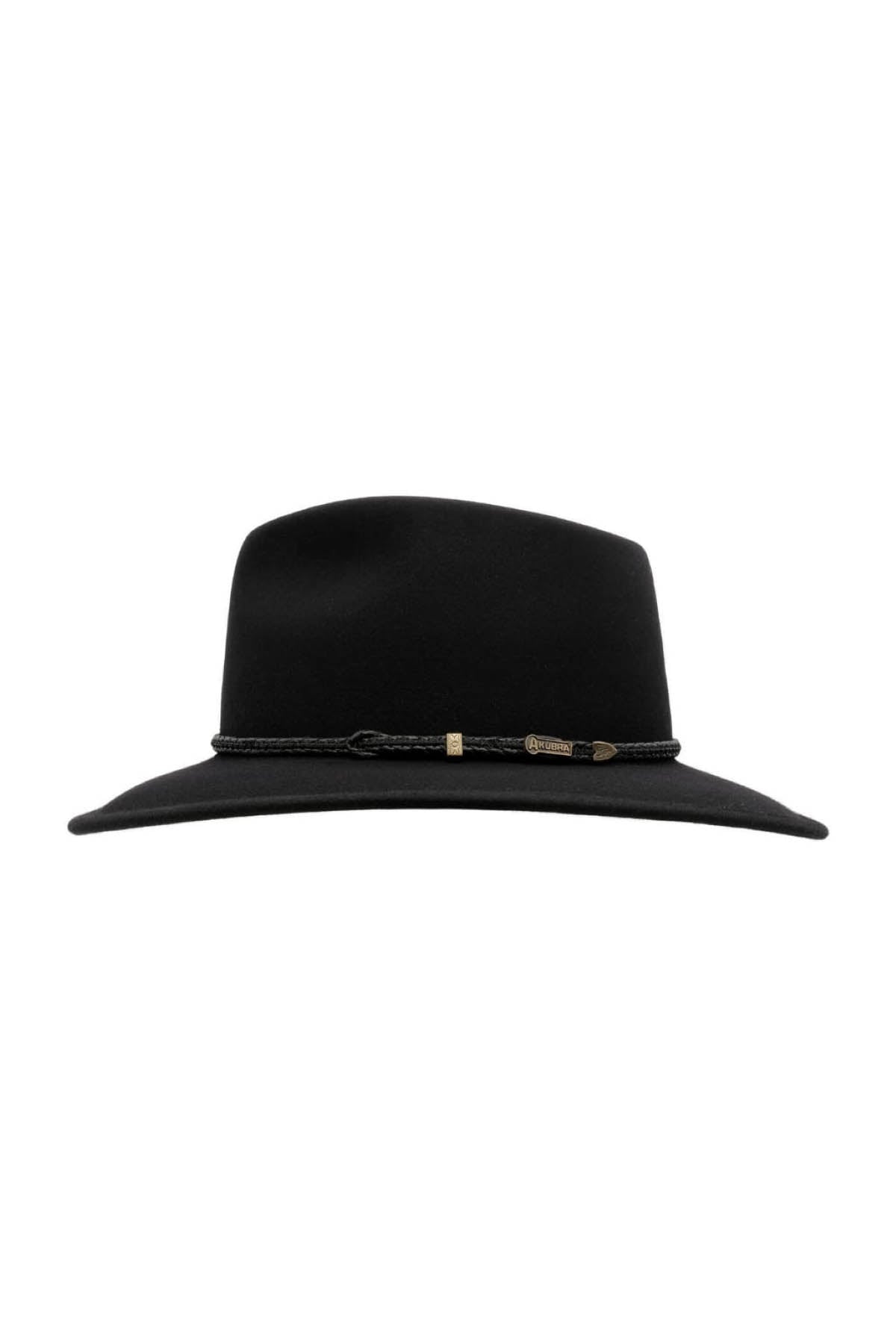The Akubra Traveller is a black fedora hat with a wide brim and a braided band accented by small metallic details, highlighted against a plain white background.