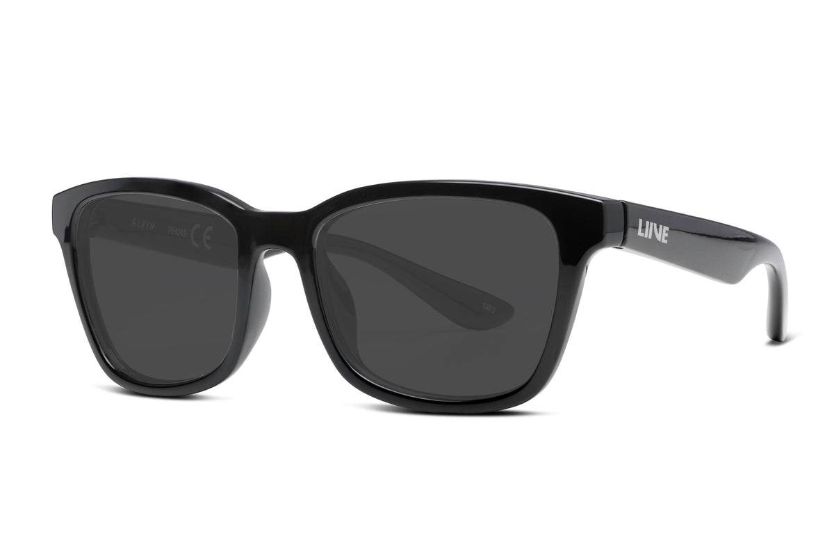 The Liive Alvin Sunglasses feature a sleek black design with glossy frames and dark UV-protective lenses. Seamlessly connected arms display "LINE" on the side, offering a classic yet modern look suitable for both casual and formal occasions.
