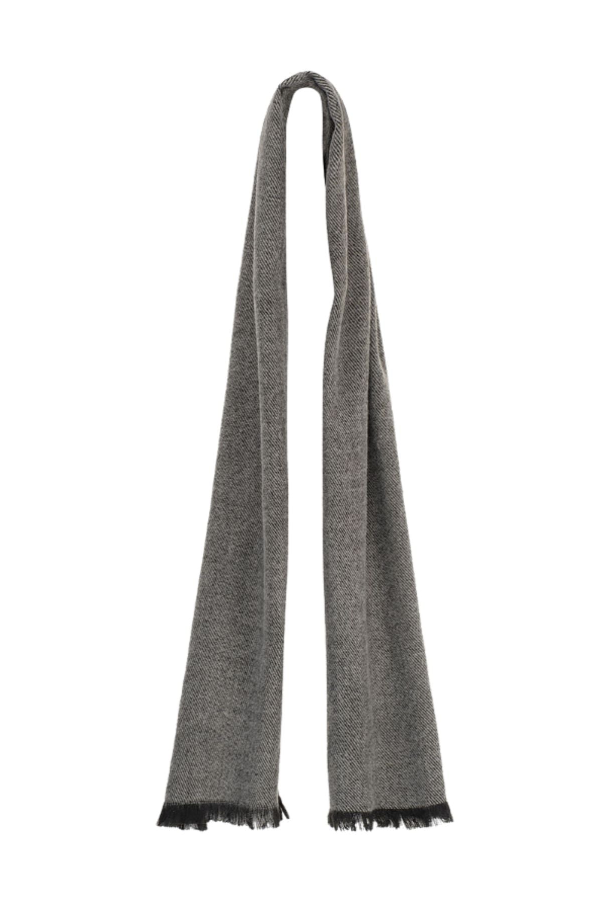 The Avenel Ryder Soft Feel Dacron Scarf is a long grey scarf with subtle texture and short black fringe at each end, offering an elegant look and soft feel, displayed against a white background.