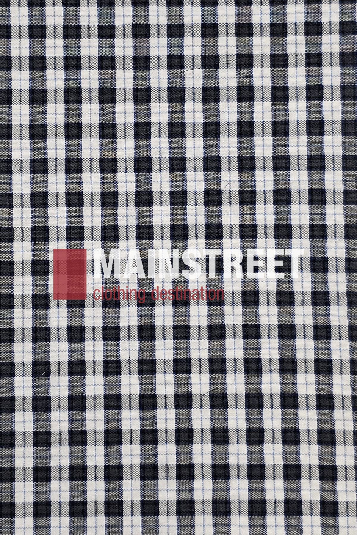 A black and white plaid fabric background displays "MAINSTREET clothing destination" in bold white and red text, evoking the timeless style of the Bisley Countryman Seersucker Short Sleeve Shirt.