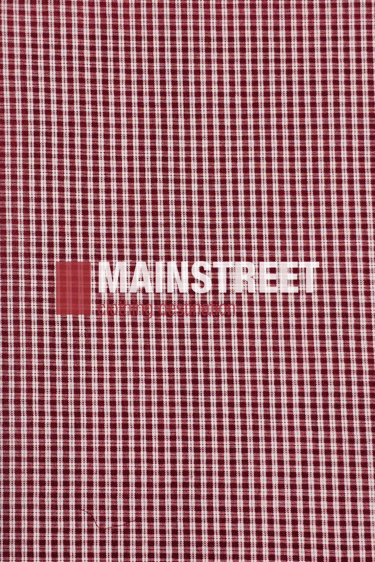 A red and white checkered fabric pattern, inspired by the Bisley Countryman Seersucker Short Sleeve Shirt, featuring "MAINSTREET" printed in bold white letters across the center.