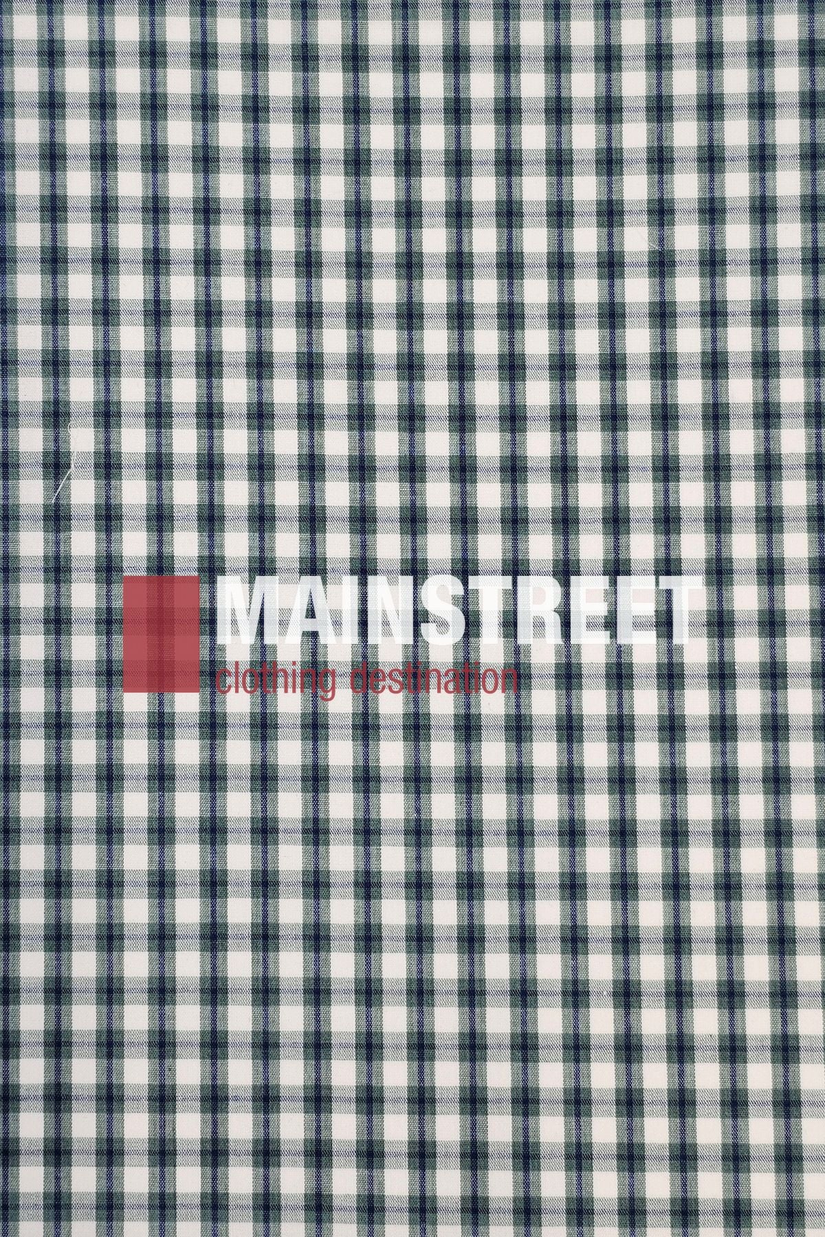 The Bisley Countryman Short Sleeve Shirt is a white cotton shirt with green and black plaid, featuring "MAINSTREET" in large white letters and "clothing destination" in small red letters next to a red square on the front.