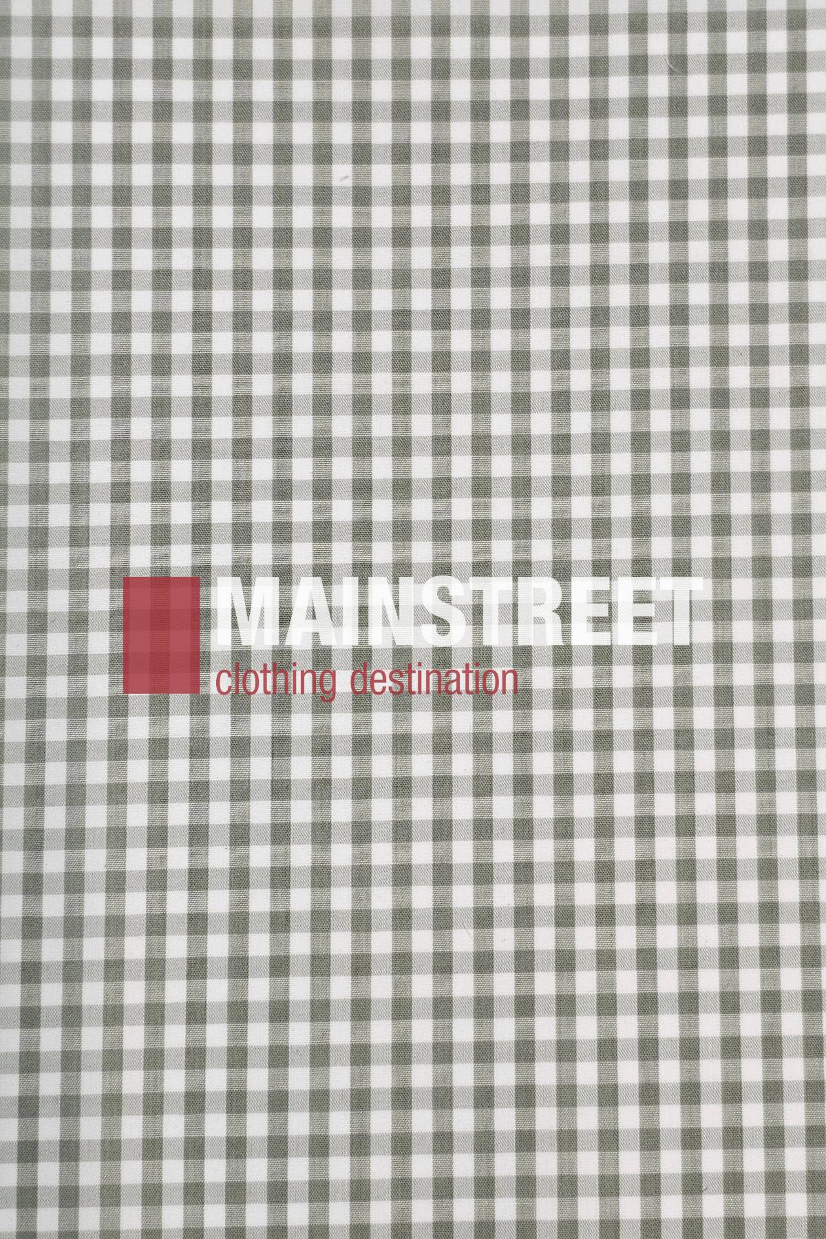 A gray and white gingham fabric background with "MAINSTREET" in bold white and "clothing destination" in red over a red square, echoing the timeless style of the Bisley Countryman Short Sleeve Shirt.
