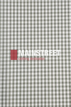 A gray and white gingham fabric background with "MAINSTREET" in bold white and "clothing destination" in red over a red square, echoing the timeless style of the Bisley Countryman Short Sleeve Shirt.