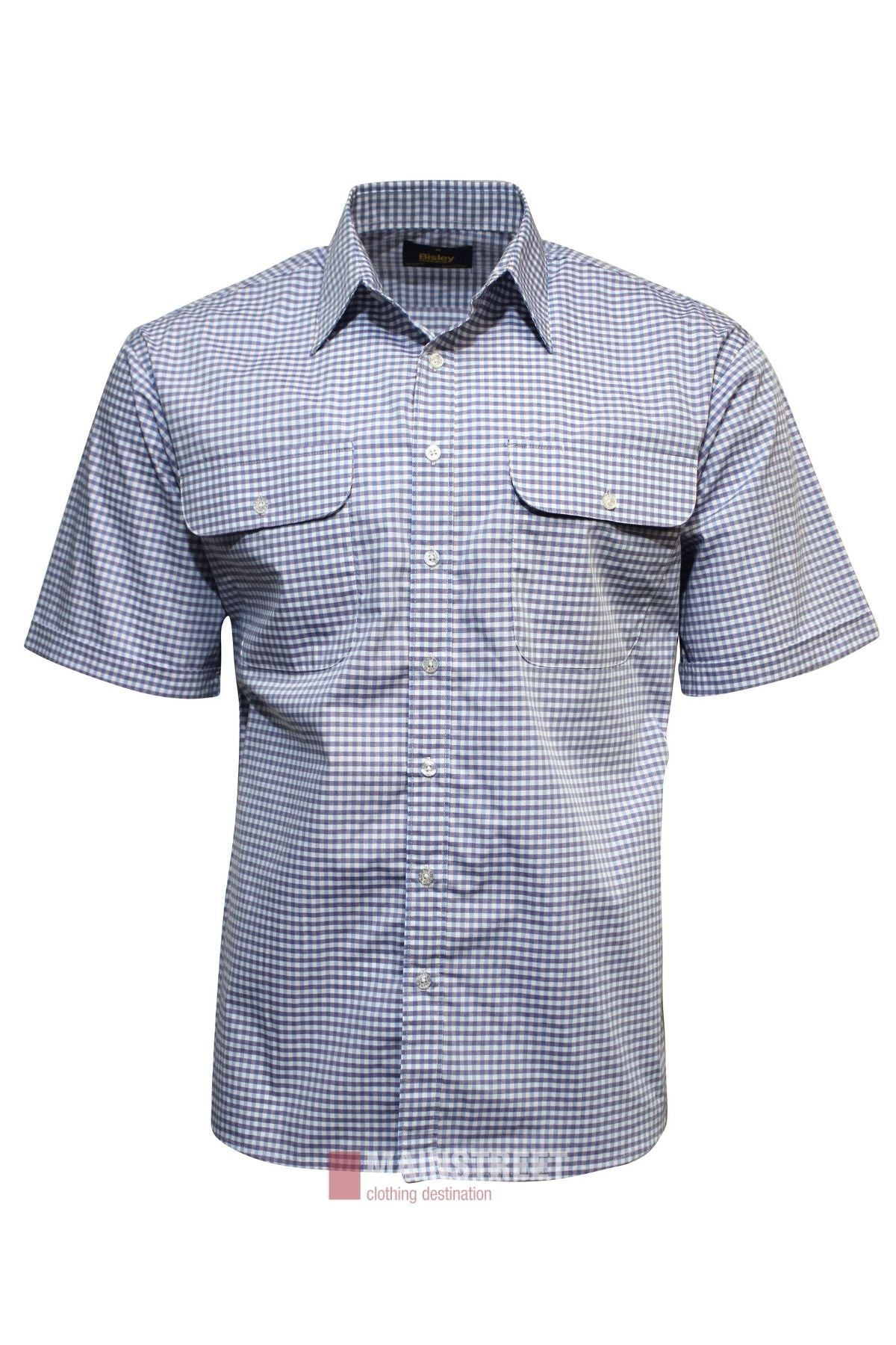 The Bisley Countryman Short Sleeve Shirt is a blue and white checkered, button-up polyester cotton shirt with two front chest pockets featuring flaps and buttons.