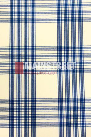 The Bisley Western Shirt is a white polyester-cotton blend with a blue plaid pattern of intersecting lines. "MAIN STREET" and "clothing destination" are printed in white and red, capturing a classic Countryman Shirt feel.
