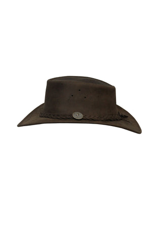 The Barmah Bushie Suede Cooler Hat is a dark brown, wide-brimmed Australian leather hat featuring a braided band, small oval metal emblem at the front, and two side ventilation holes for comfort.