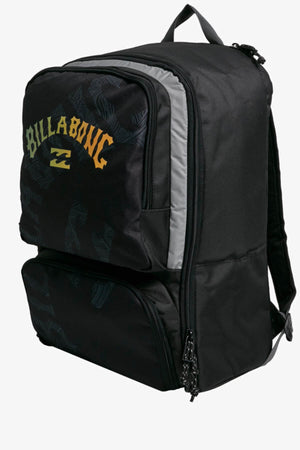 The Billabong Juggernaut Backpack in black showcases a yellow wave logo and subtle pattern, offering two main compartments with a laptop compartment. It's designed for comfort with a top handle and adjustable padded shoulder straps, complemented by sleek black zipper pulls.