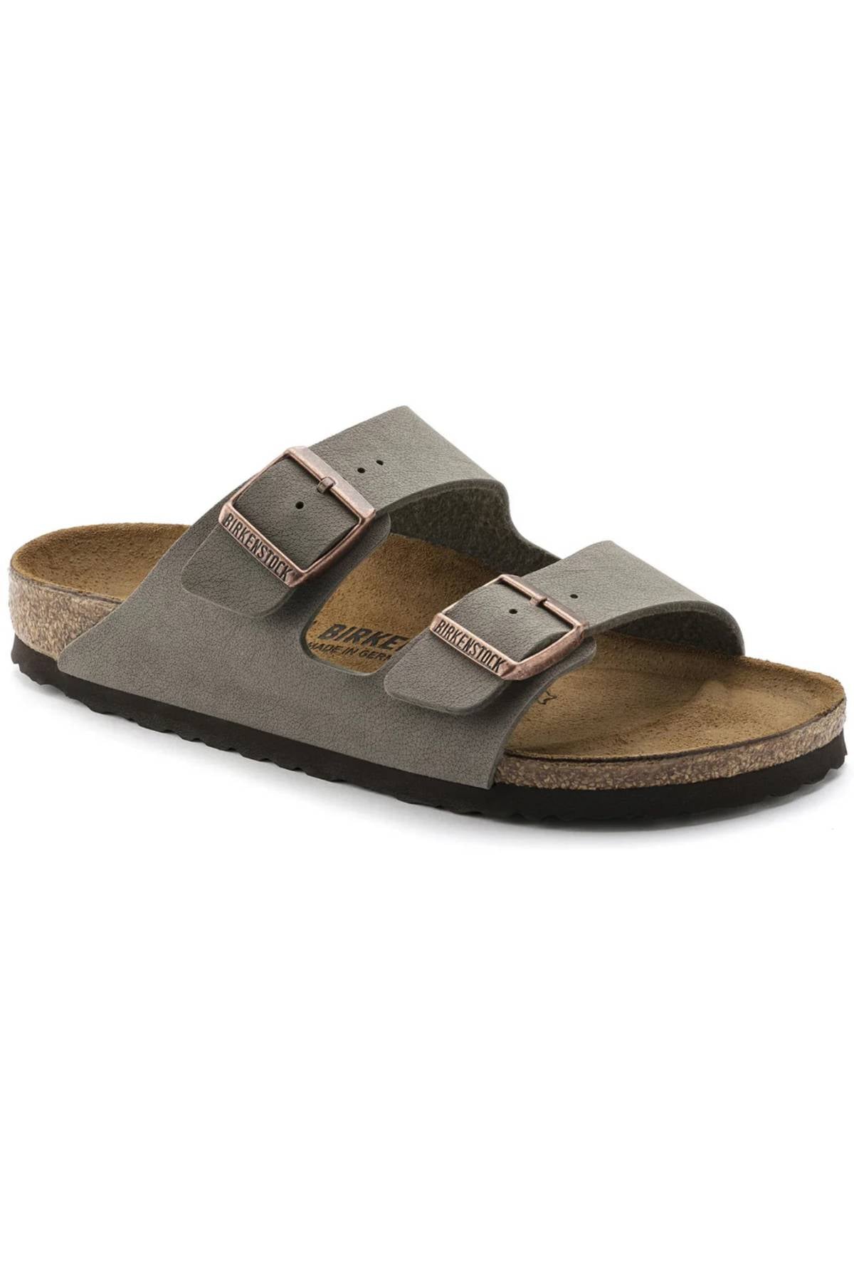 The Birkenstock Arizona sandal features a gray color, two adjustable buckles, a contoured comfort footbed, and a black sole, shown from a side angle.
