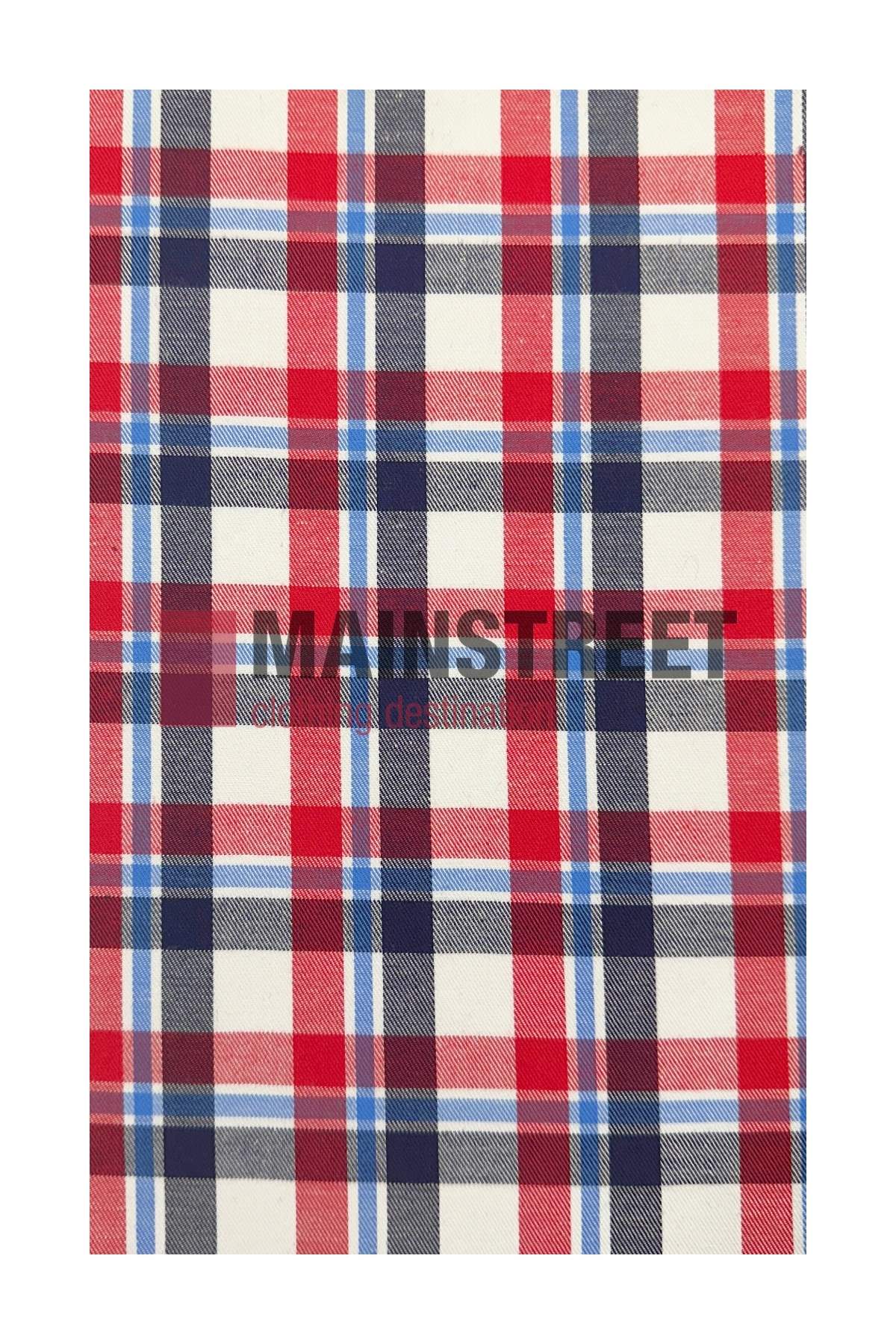 Red, white, and blue plaid fabric with horizontal and vertical stripes forming squares. "MAIN STREET" is faintly visible across the center, reminiscent of a Bisley Countryman Cotton Shirt with buttoned chest pockets.