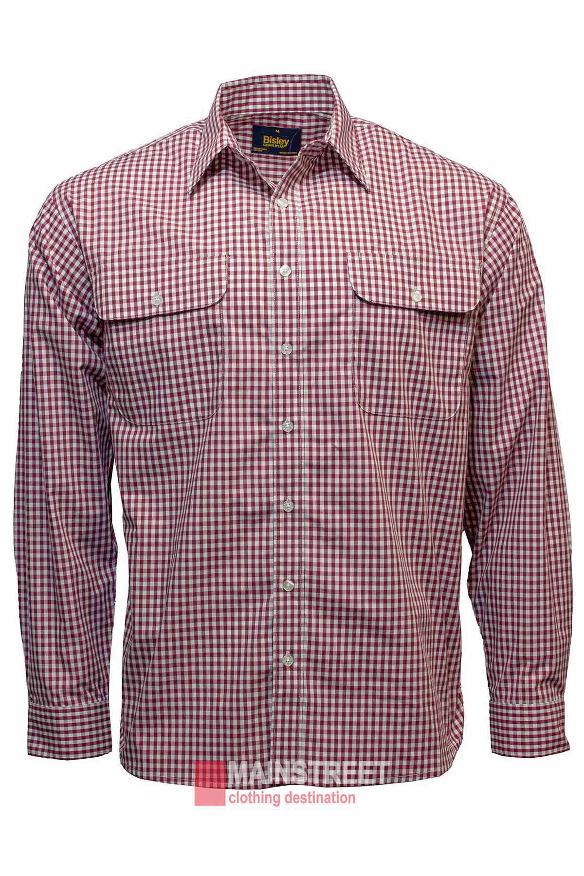The Bisley Countryman Shirt is a red and white checkered long-sleeve button-up made from a soft polyester/cotton blend. It includes two buttoned chest pockets and appears against a white background, effortlessly combining rustic charm with modern style.