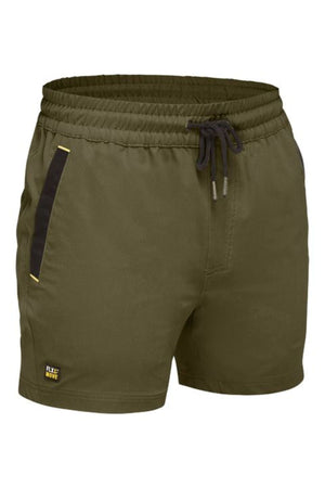 The Bisley Flex & Move 4 Way Stretch Elastic Waist Short in olive green features a black drawstring, black-trimmed side pockets, a small yellow "Rex Move" logo, elastic waistband, relaxed fit, and 4-way stretch for comfort and flexibility.