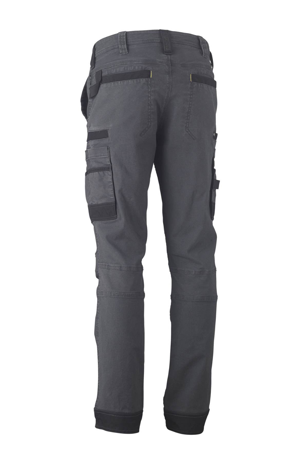 The image showcases the Bisley Flex & Move Stretch Utility Cargo Pant in dark gray, photographed from the back. Crafted from Cordura, these pants feature multiple cargo pockets, including large side pockets, and boast a rugged, durable design.