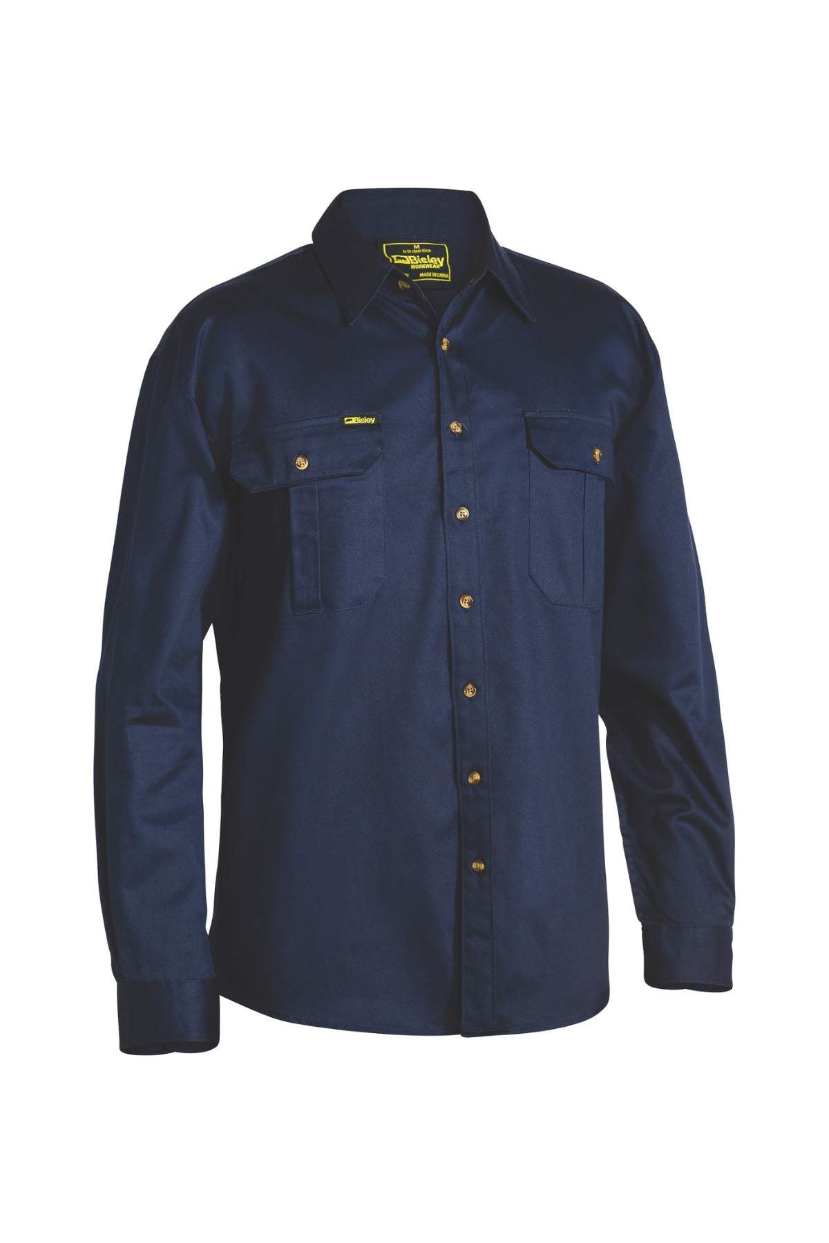 The Bisley Original Cotton Drill Shirt is a navy blue, long-sleeve work shirt made from cotton fibre. It features button closures, UPF 50+ protection, two chest pockets, and a classic collared design.