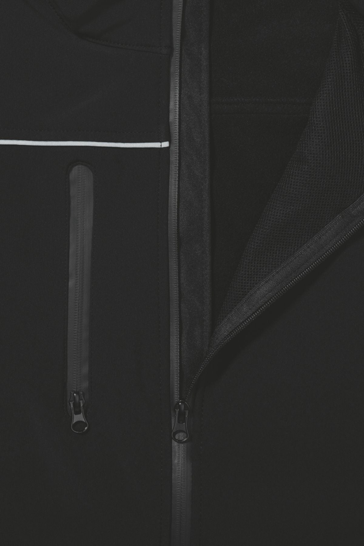Close-up of the Bisley Soft Shell Jacket, showcasing its showerproof black design. The partially open front zipper and additional vertical zippered pocket on the left side are highlighted, along with a thin white stripe running horizontally above the pocket. Reflective piping enhances visibility.