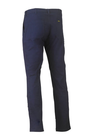 The Bisley Stretch Cotton Drill Work Pant in dark blue is shown from the back at an angle, highlighting the rear pockets and belt loops, set against a plain white background.