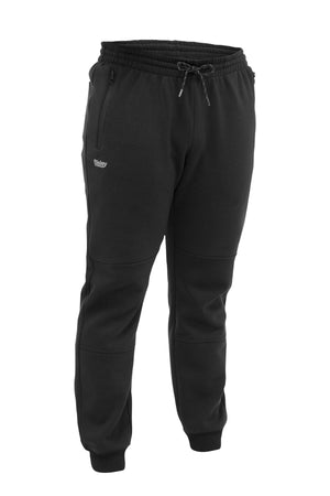 The Bisley Work Fleece Trackpant features a black fleece design with an elastic waistband, drawstring, side zip pockets, small left thigh logo, tapered fit, and ribbed ankle cuffs for comfort and style.