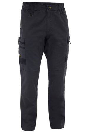 The Bisley Flex & Move Stretch Canvas Elastic Waist Cargo Pant in black features multiple pockets, zipper and button closure, reinforced knees, and is made from stretch cotton canvas, shown against a white background.