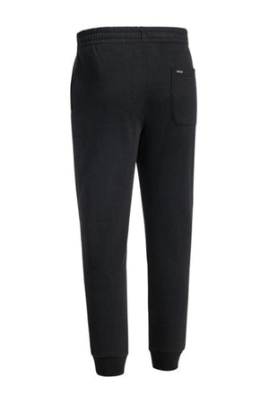 The Bisley Work Trackpant is a black slim fit style seen from the back, with an elastic waistband, side pockets, a right back pocket, and fitted ankle cuffs in a soft cotton/polyester blend.