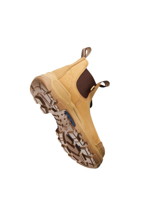 A Blundstone RotoFlex 9000 Elastic Sided Safety Boot in tan, featuring dark brown elastic side panels and pull tabs. Made from water-resistant nubuck leather, the sole boasts a rugged, multi-directional tread pattern for superior grip and stability. The boot is positioned to display both the underside and part of the side.