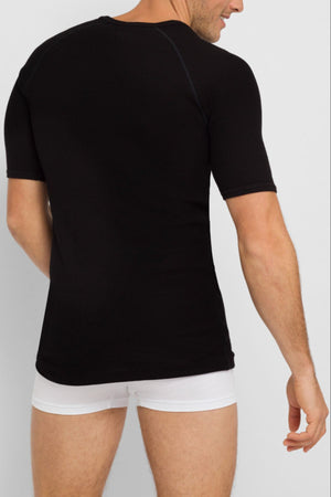 A man, seen from behind, wears a fitted black Bonds Aircel Short Sleeve Tee and white boxer briefs against a plain background.
