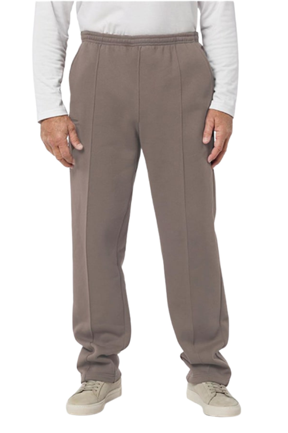 A person wears Breakaway Classic Snowy Mt Fleece Pants in taupe, paired with a long-sleeve white shirt and light beige sneakers against a white background. The image is cropped at the shoulders, highlighting comfy casual style.
