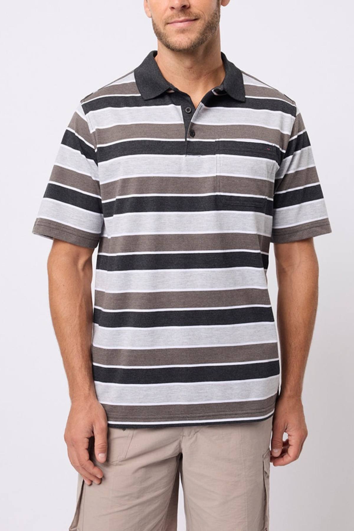 A man wears the Breakaway Coleman Kinnersly Polo, a striped men’s polo shirt, with light cargo shorts against a plain light background.
