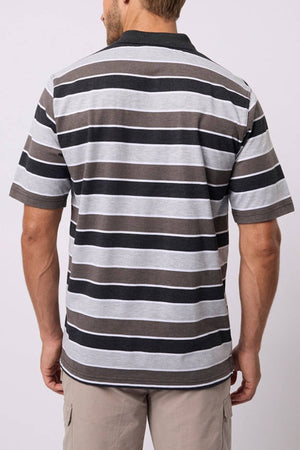 A man is seen from behind wearing the Breakaway Coleman Kinnersly Polo with gray, black, and white horizontal stripes, paired with beige shorts.