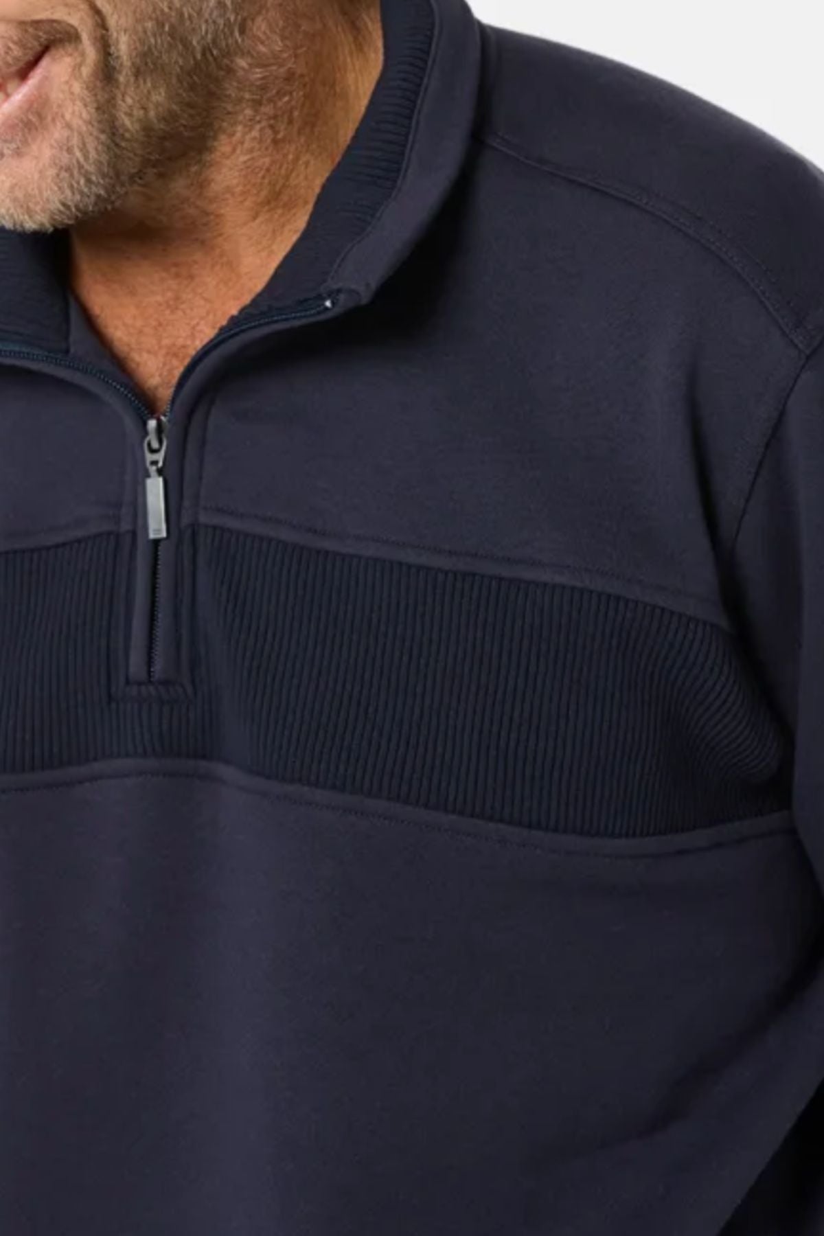 A man is wearing the Breakaway Zed Snowy Mt Fleece Half Zip in navy blue, featuring a ribbed chest design. The image shows him from shoulders to mid-torso, with his short beard partially visible.