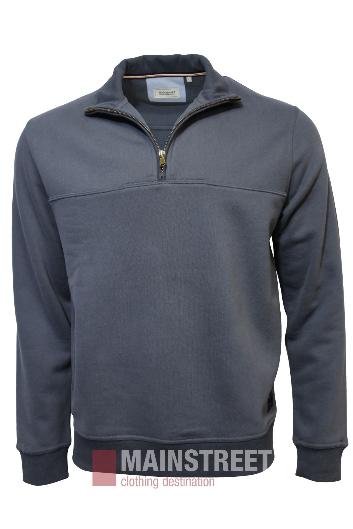The Bridgeport Half Zip Alpine Fleece is a blue long-sleeve pullover with a quarter-zip front and stand-up collar, shown on a white background. The Mainstreet Clothing Destination logo appears at the bottom of the image.