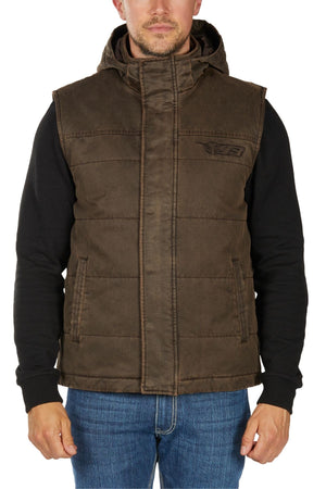 A man wearing the Bullzye Canon Vest over a black hoodie and blue jeans stands with his arms relaxed at his sides against a plain white background.