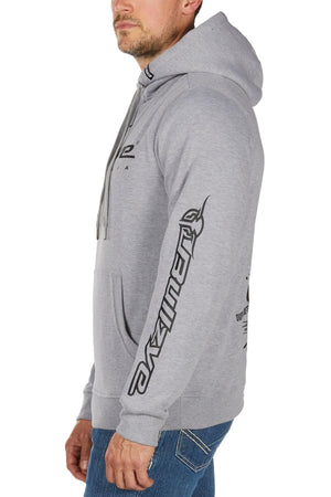 A man in a Bullzye Determination Hoodie with black graphic text on the sleeve and chest, paired with blue jeans, stands in profile against a white background.