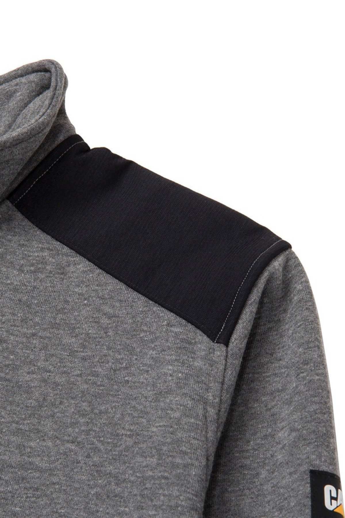 Close-up of the CAT Essential 1/4 Zip Sweatshirt, showcasing its grey design complemented by nylon shoulder overlays. It features a high collar and a visible sleeve adorned with a logo patch at the end. The fabric looks exceptionally soft and comfortable, making it ideal for everyday wear.