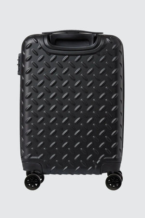 The CAT Industrial Plate 20" Trolley, a black hard-shell carry-on with a diamond plate pattern, four wheels, and a recessed handle, stands upright against a plain light gray background.