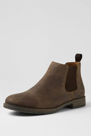 The Colorado Lizard Oil Suede Boot is a single brown oiled suede Chelsea boot with elastic side panels, a heel pull tab, and a durable sole, displayed against a plain light gray background.