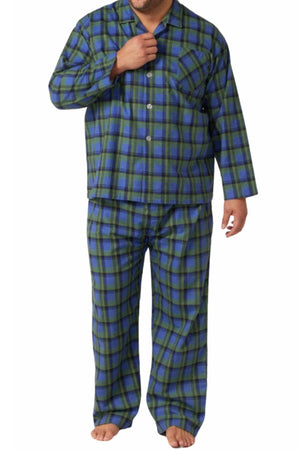 A man stands barefoot against a white background wearing the Contare Country Winter Flannelette PJ Set in blue and green plaid.