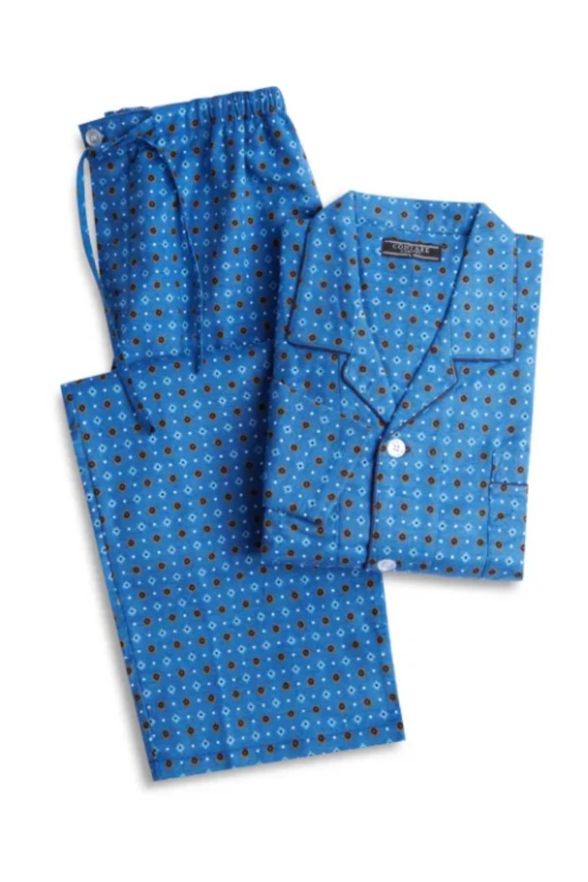 Experience the comfort of our Contare Country Winter Flannelette PJ Set. Made from soft brushed cotton, this blue set with a brown and white circle pattern features a button-up collared shirt and matching drawstring pants for a cozy night's sleep.
