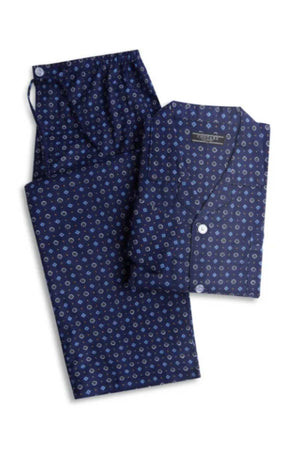 The Contare Country Winter Flannelette PJ Set features dark blue brushed cotton pyjamas with a white and blue circular pattern, including a button-up long-sleeve shirt and matching pants for comfort.