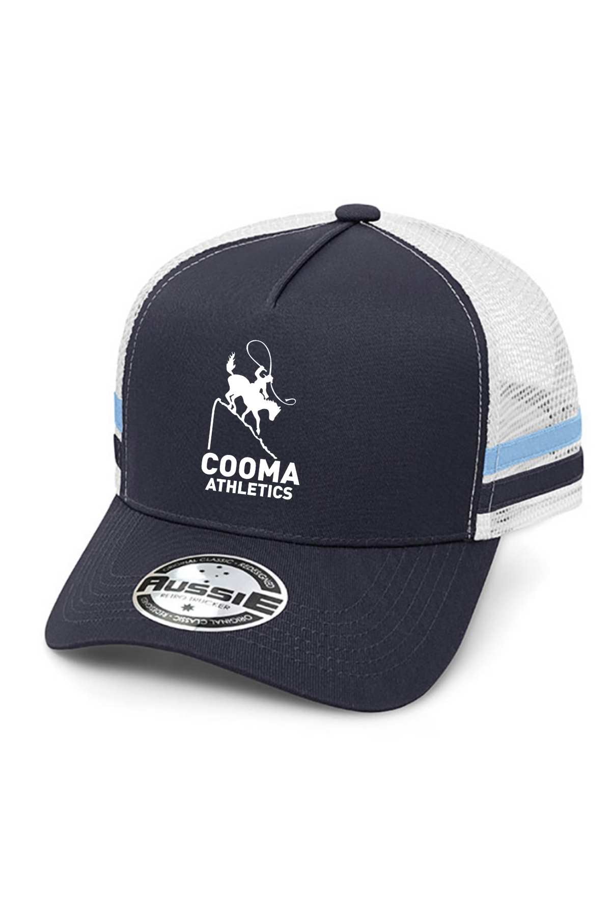 The Cooma Athletics Kids Stripe Trucker Cap, a pre-order item, comes in navy blue and white and showcases the Cooma Athletics bull logo. It features a mesh back with light blue and black stripes on the sides and is adorned with a sticker on the brim.