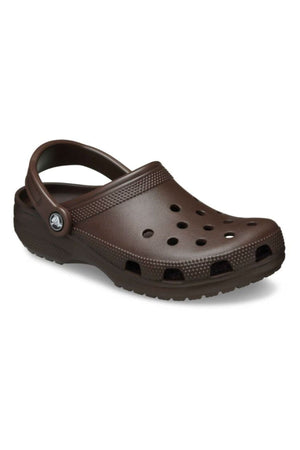 The Crocs Classic Clog is a single brown sandal with top and side ventilation holes plus a pivoting heel strap—the lightweight, breathable footwear for all-day comfort.