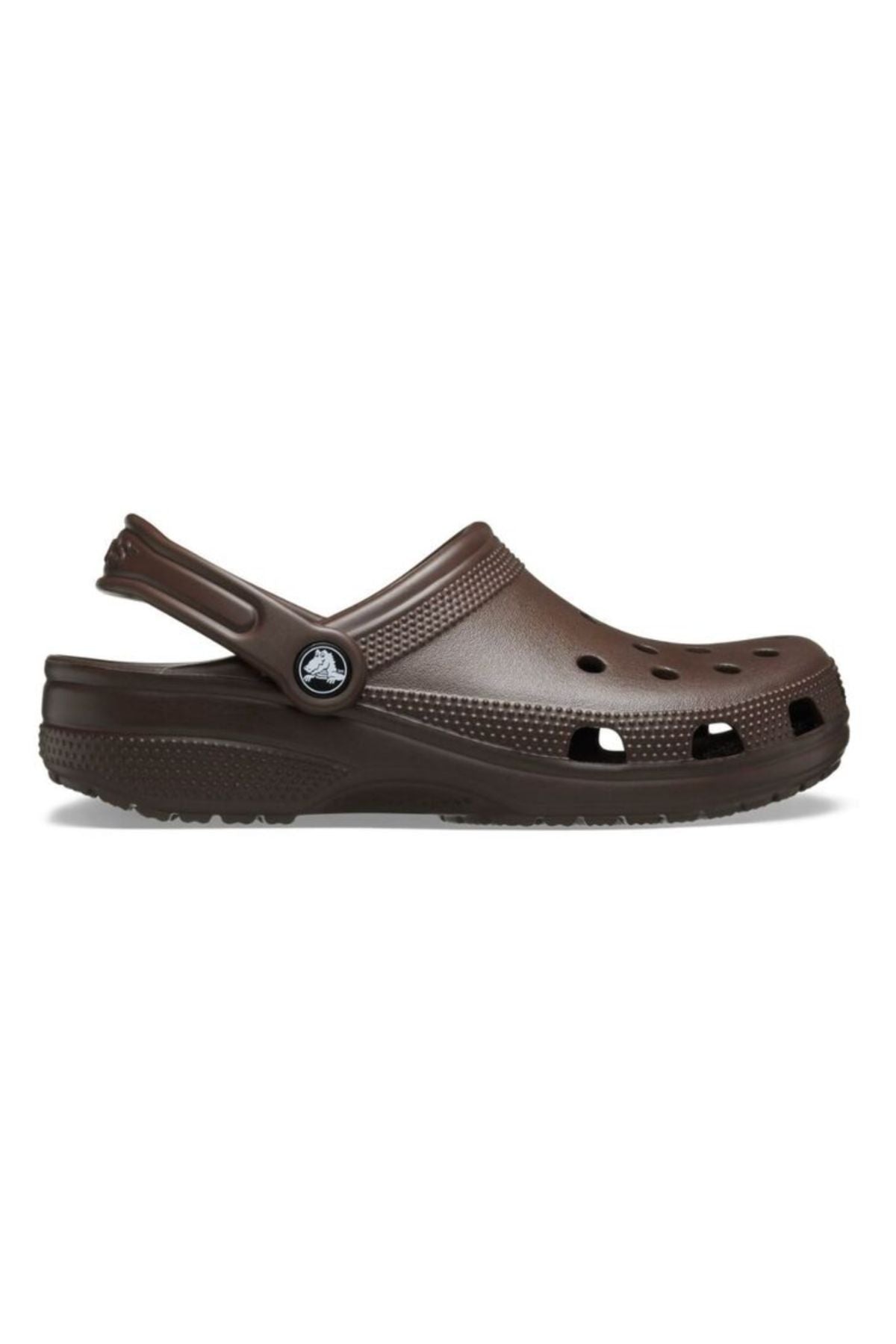 The Crocs Classic Clog in brown features a back strap, round toe, and ventilation holes for breathability—ideal for water adventures. Displayed in side profile on a white background.