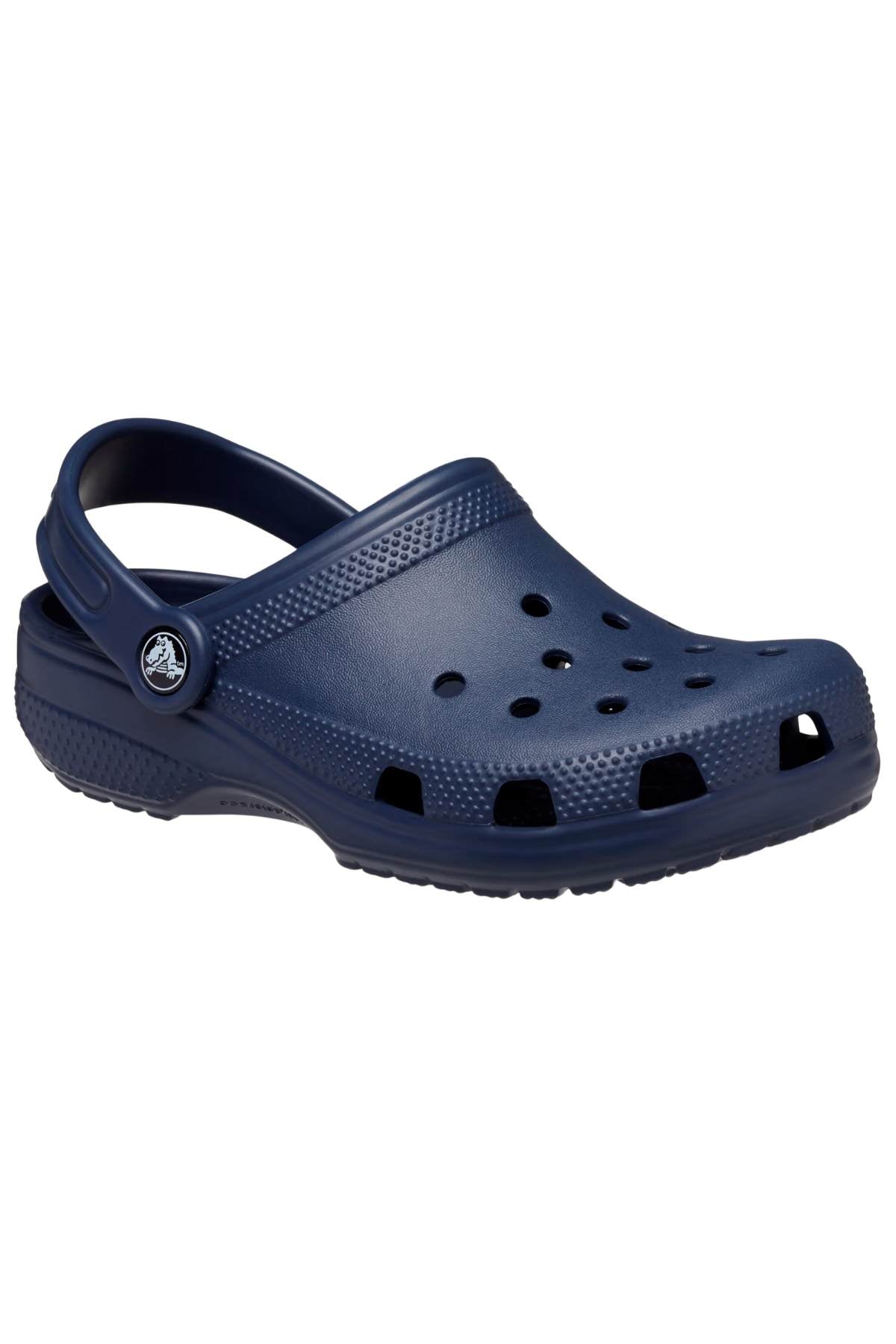 The Crocs Classic Kids Clog, shown as a single dark blue shoe, is made from Croslite™ material providing iconic Crocs Comfort™, with ventilation holes and a heel strap, displayed on a plain white background.