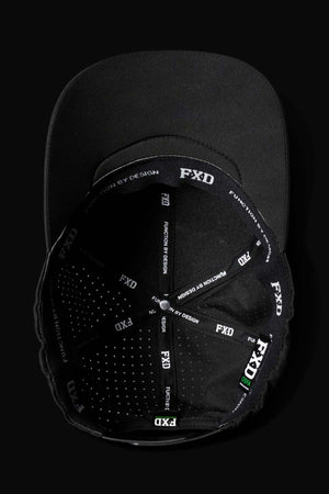 The FXD CP-12 Tech Baseball Cap, black from above, showcases a detailed interior with "FXD" and "FUNCTION BY DESIGN" in white along the seams of its predominantly black lining. It features lightweight, quick-drying performance polyester for structured style.
