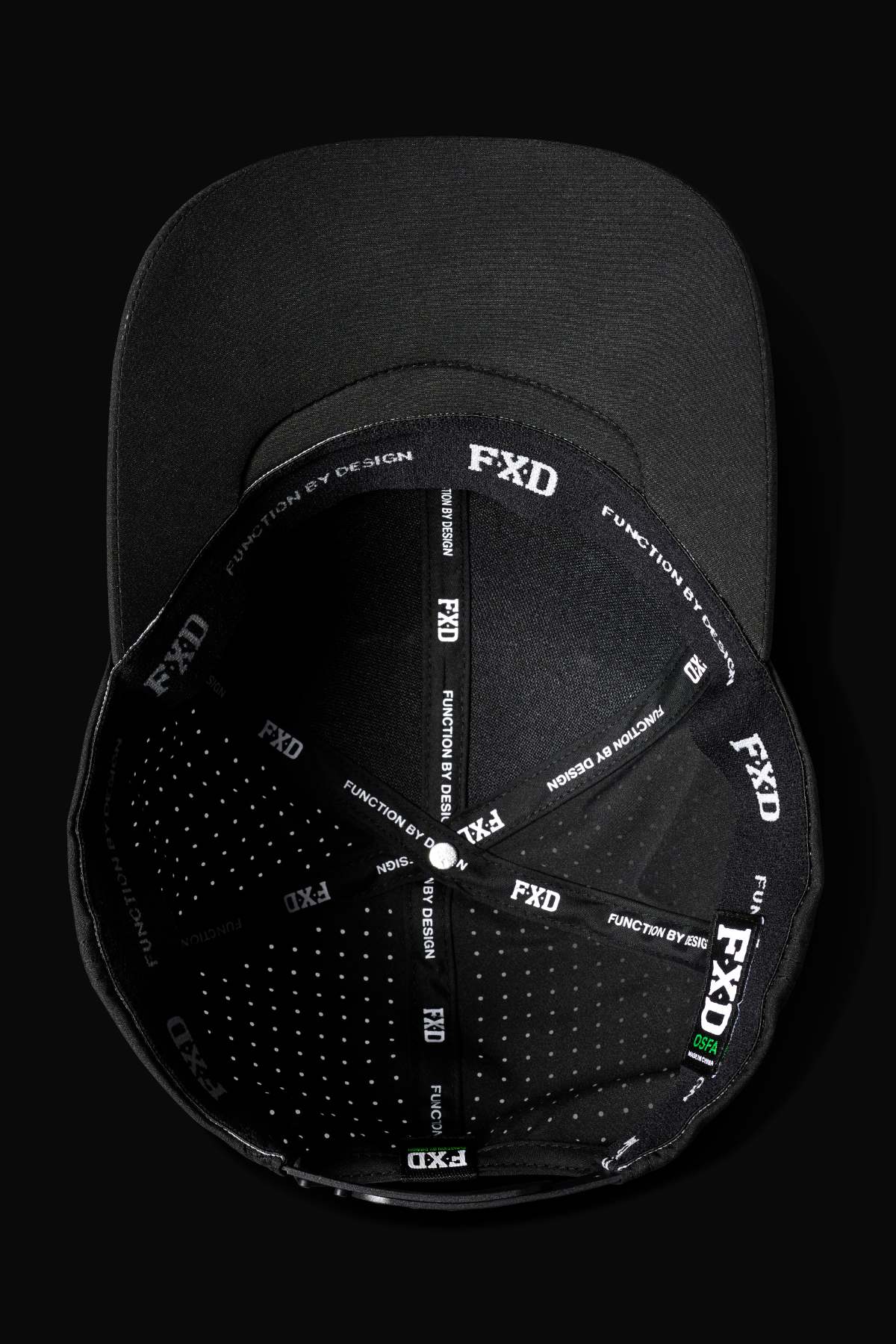 The FXD CP-12 Tech Baseball Cap is shown from above, featuring quick-drying stitched panels with "FXD" and "FUNCTION BY DESIGN" in white on black, plus an adjustable snap-back for comfort.