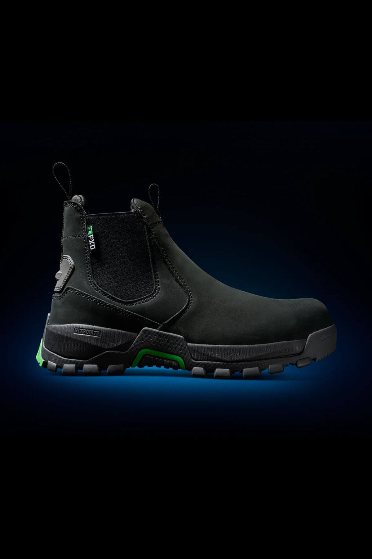 Introducing the FXD WB-4 Work Boot: a sleek black slip-on boot with a rugged sole and a striking teal green accent on the outsole. Made from durable Nubuck leather, it includes convenient pull tabs on both the front and back for easy wearing. The textured midsole enhances grip, while the safety toe ensures additional protection. Displayed against a dark background with a subtle blue gradient, this work boot stands out in style and functionality.