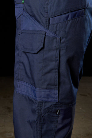 Close-up image of the side pocket on the navy blue FXD WP-5 work pants. The pocket is secured with a Velcro flap and crafted with durable, double-stitched fabric that incorporates advanced stretch material, making it perfect for heavy-duty use or construction work. The lighting highlights the texture perfectly.