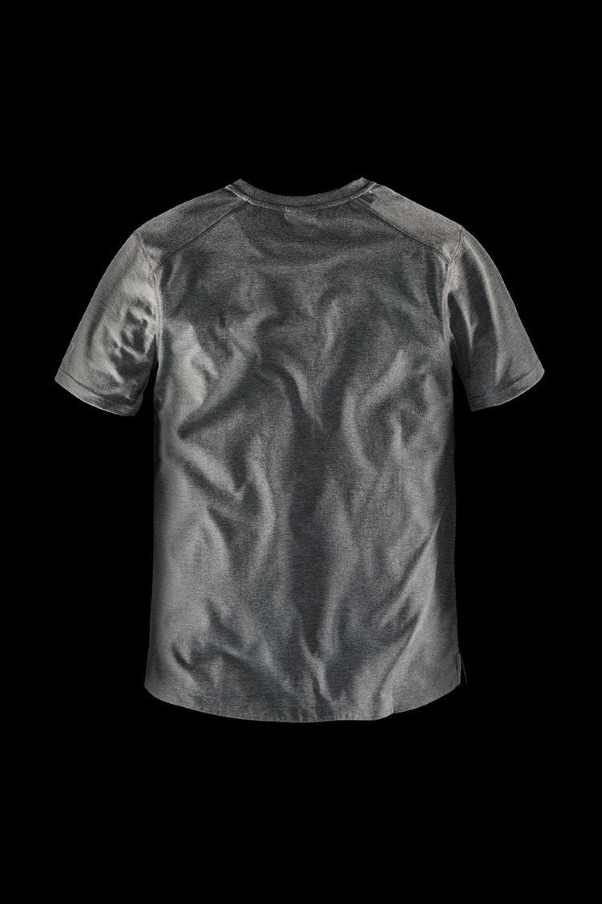 The FXD WT-3 Tech Tee, a gray short-sleeved T-shirt made from recycled polyester, is displayed against a black background. The back of this comfortable, solid-colored tee is shown, revealing subtle creases in the fabric.